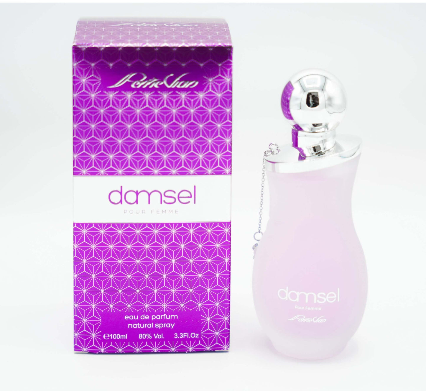 A pink bottle of DAMSEL EDP for women, with a silver cap, displayed on a white surface with purple flowers around it.