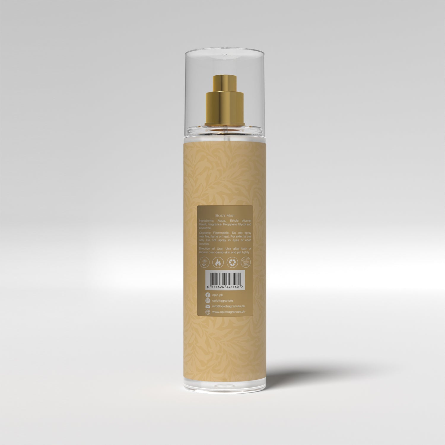A clear spray bottle with a gold-colored cap