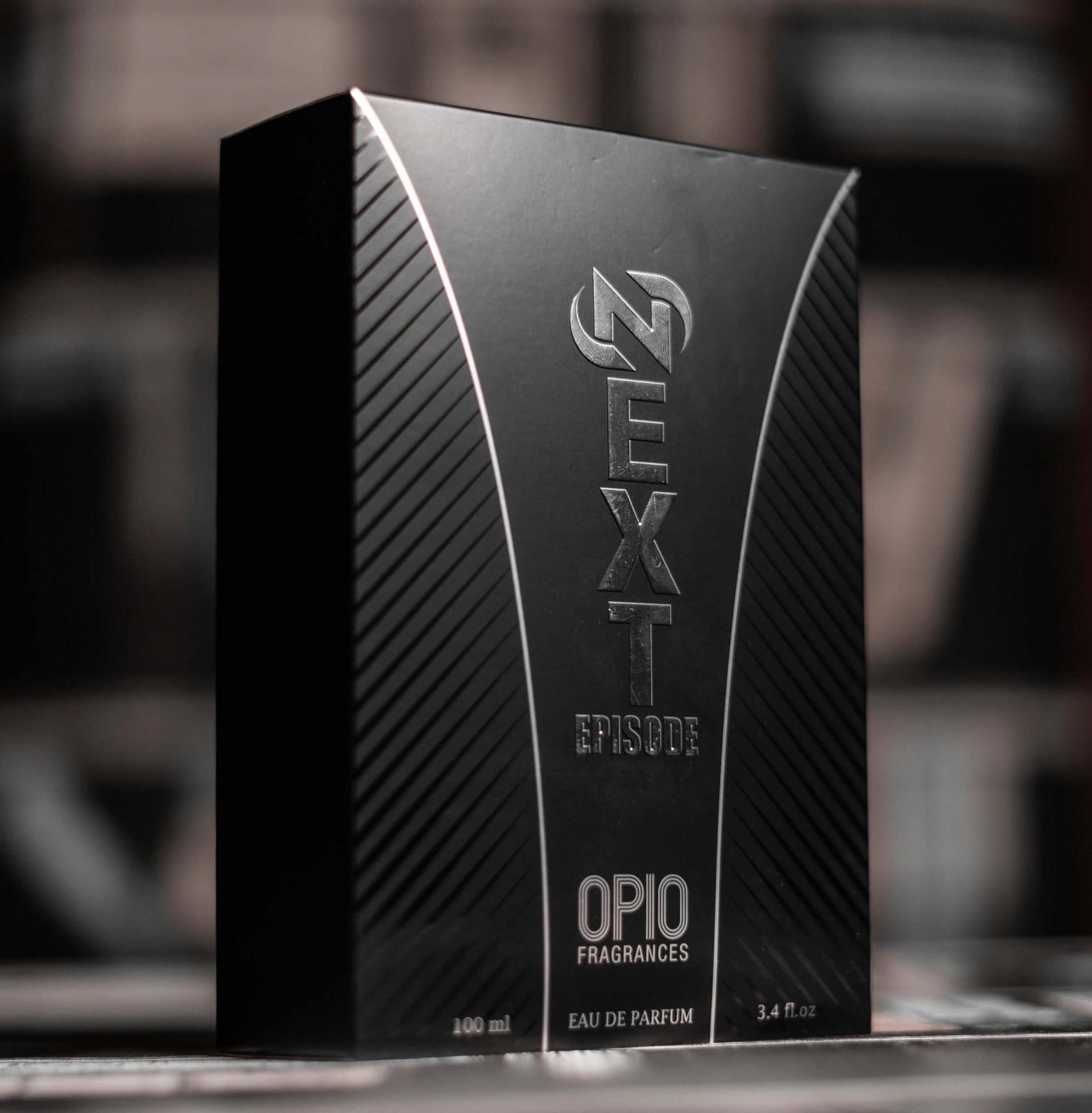 A black perfume box of 'NEXT EPISODE EDP' by OPIO.