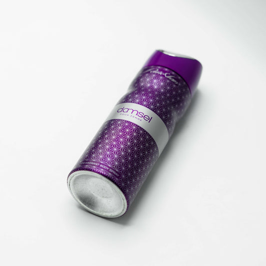 A 200ml can of Damsel body spray for women, the can is predominantly purple with a geometric pattern and the brand name 'Damsel' displayed on the front.