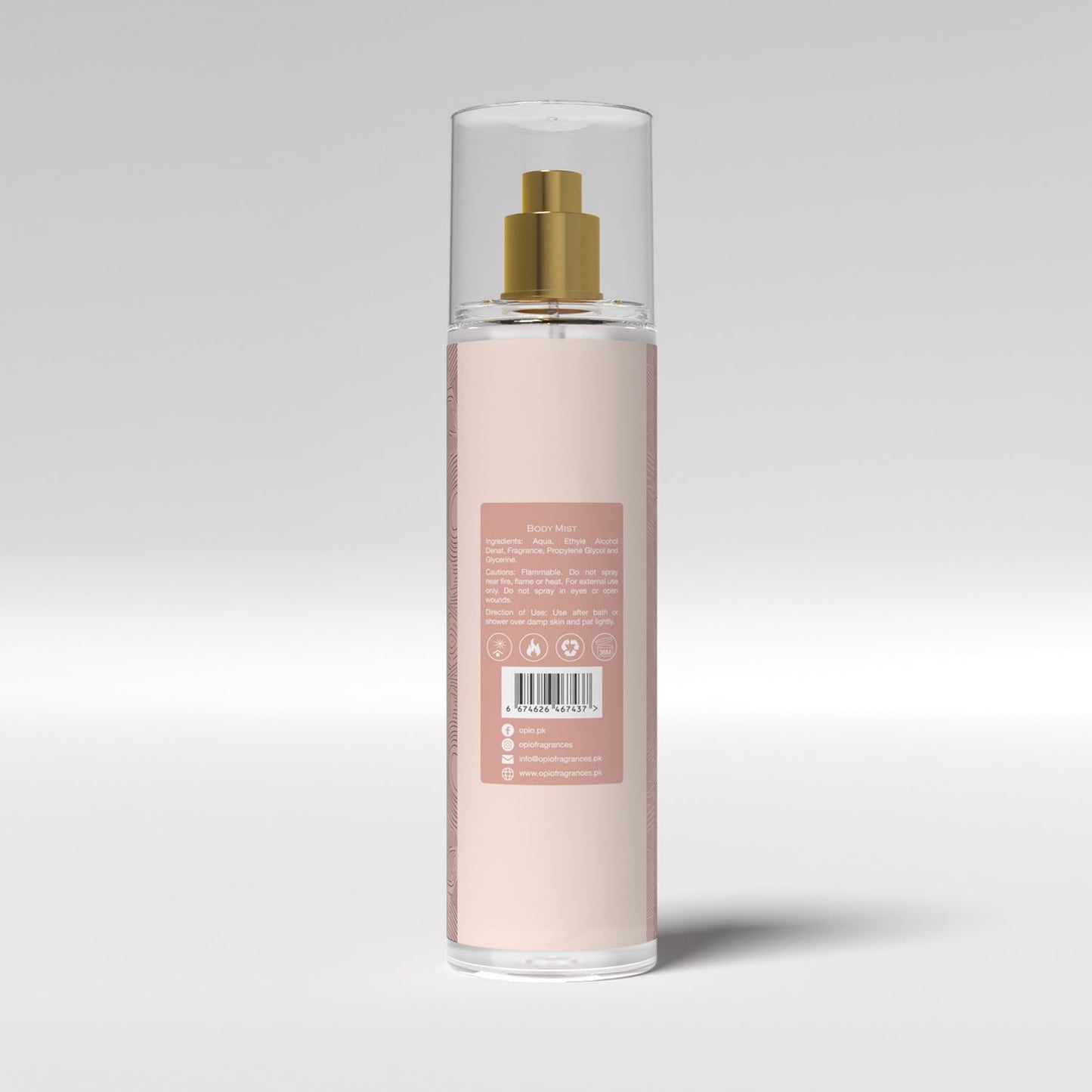 A bottle of body mist with a floral design