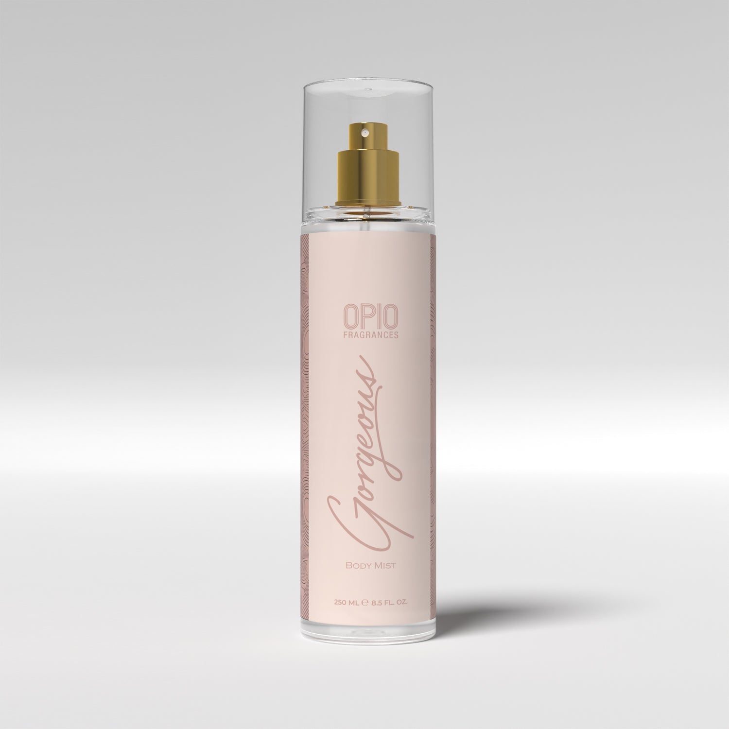 A bottle of body mist with a floral design.