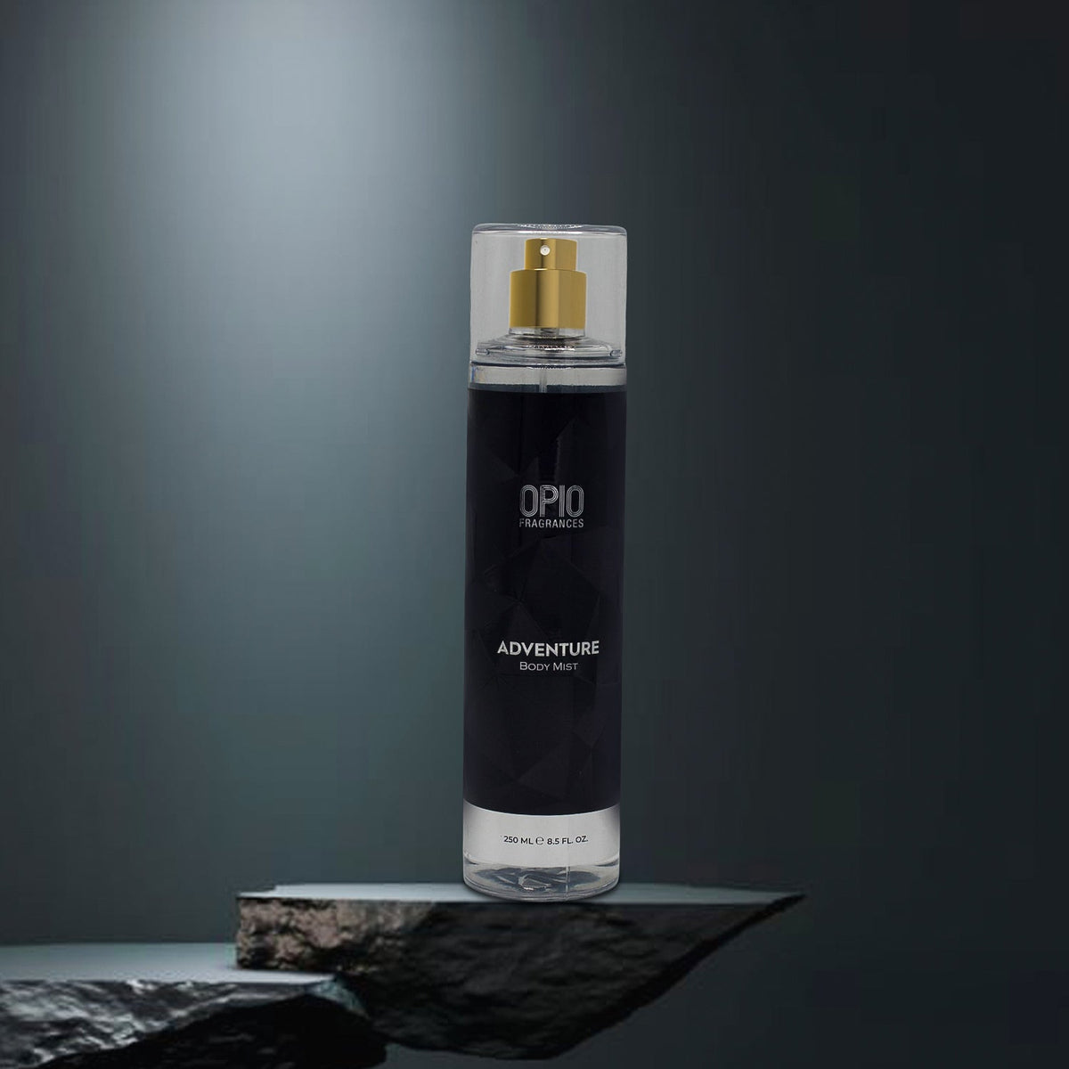 Black body mist bottle with gold cap on a dark gray background
