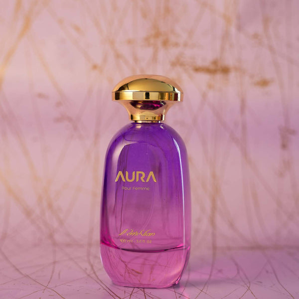 A purple colored perfume bottle with a gold cap. The label reads 'AURA' and 'EdP 100ml'.