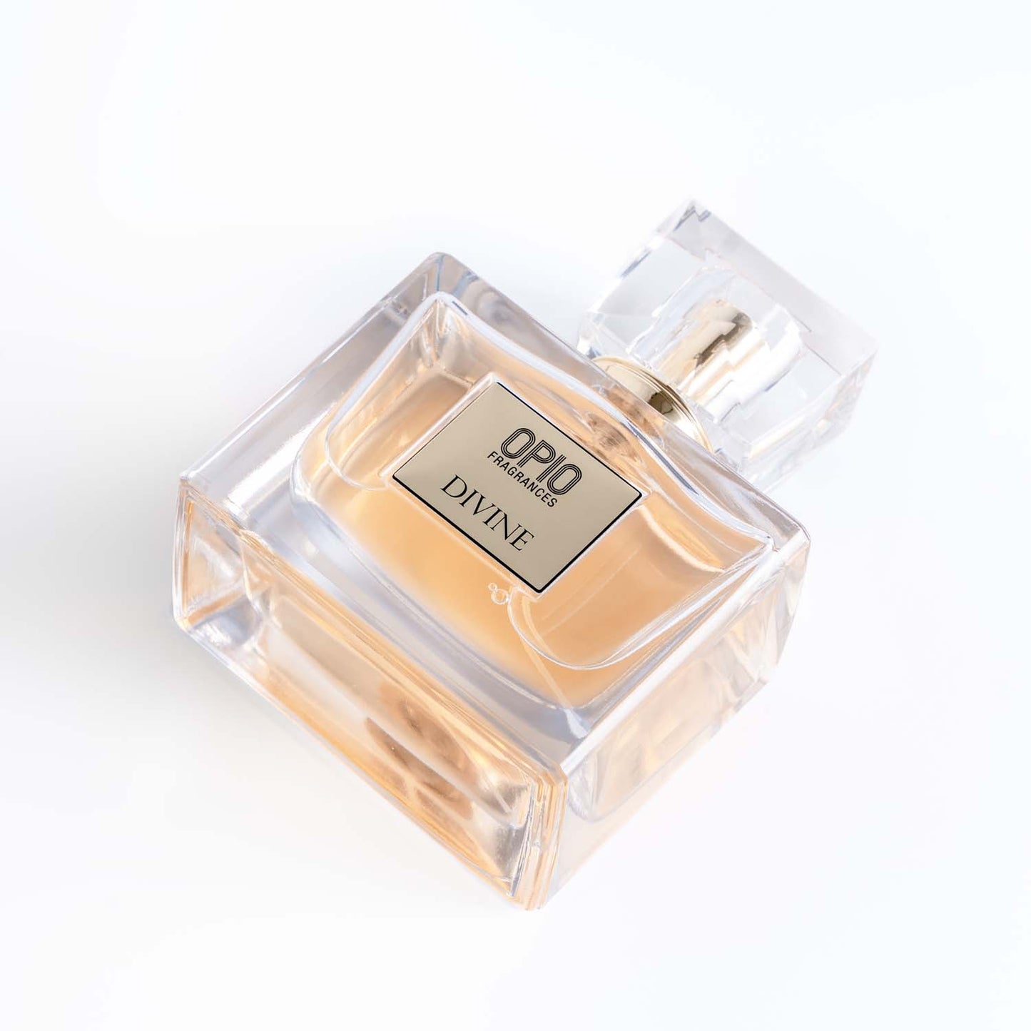 A clear bottle of perfume labeled 'DIVINE' with a transparent cap.