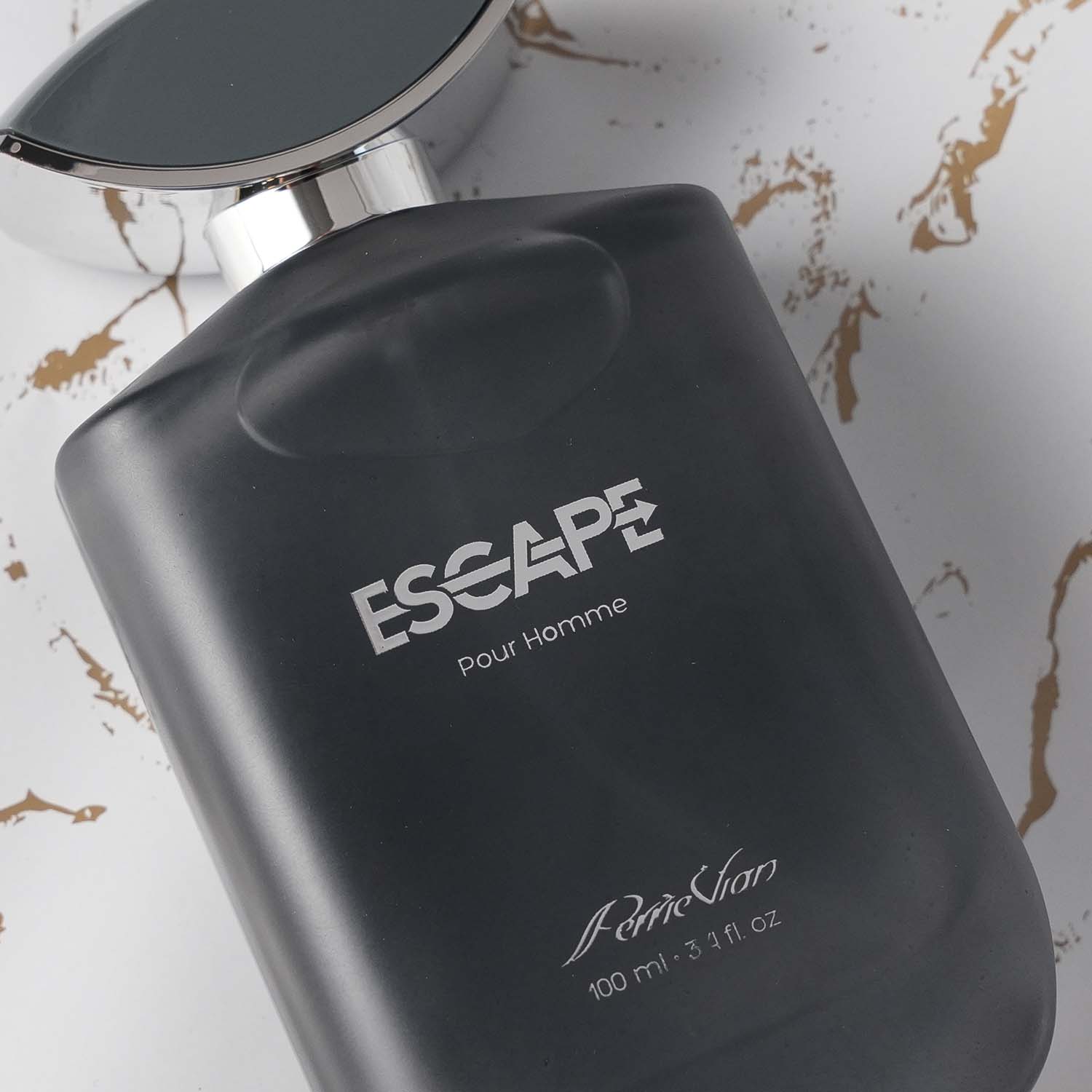 Black perfume bottle with 'ESCAPE Pour Homme' text on a marble background.
