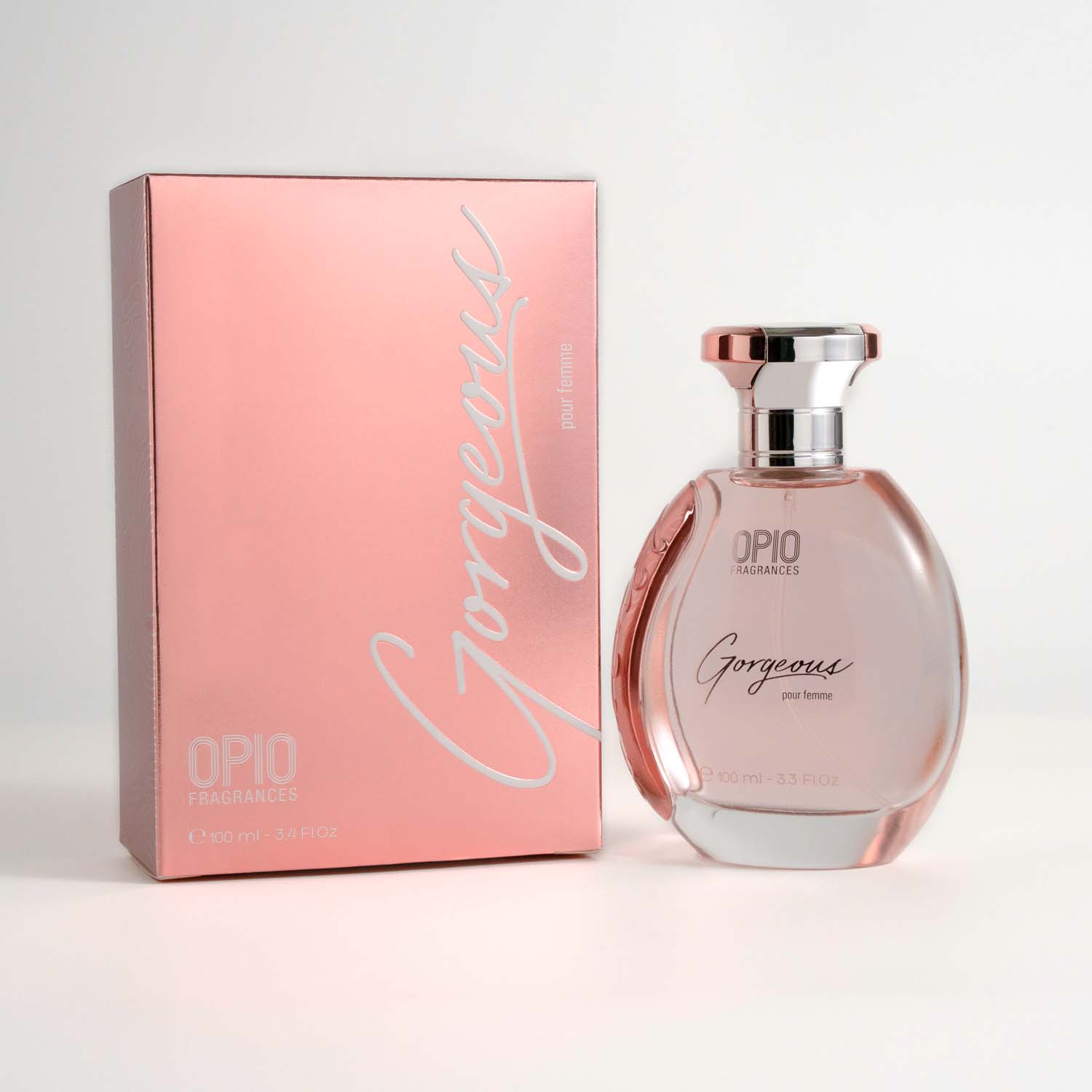 A bottle of OPIO Gorgeous women's fragrance, with a clear, pink-colored liquid visible inside and with box.