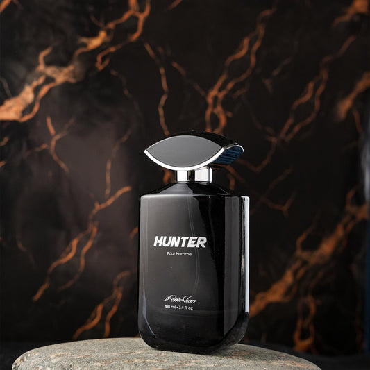 A black bottle of HUNTER EDP for men with a silver cap, displayed against a marble effect background.