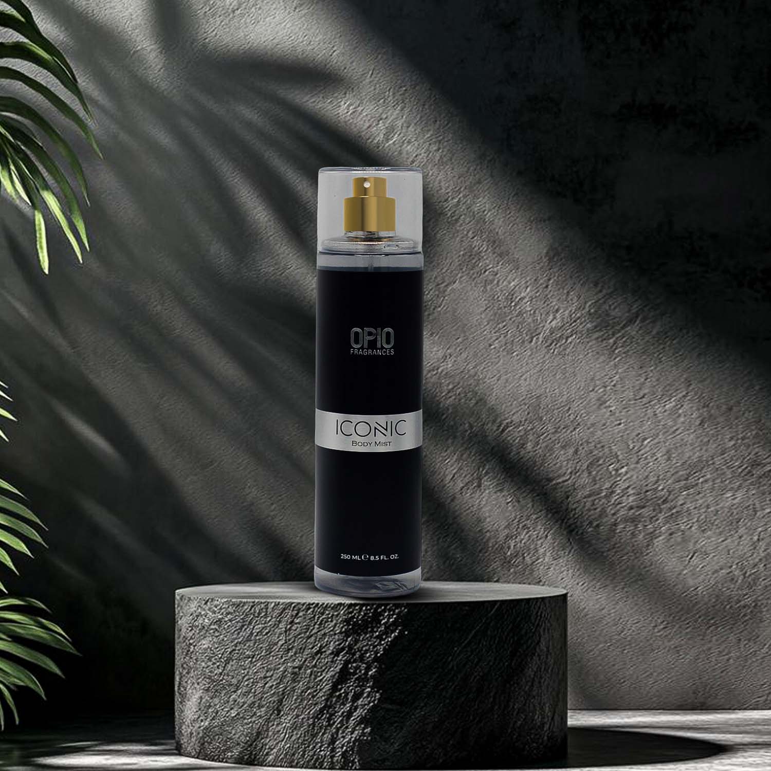 Black spray bottle labeled 'Iconic' on a stone platform with a dark background