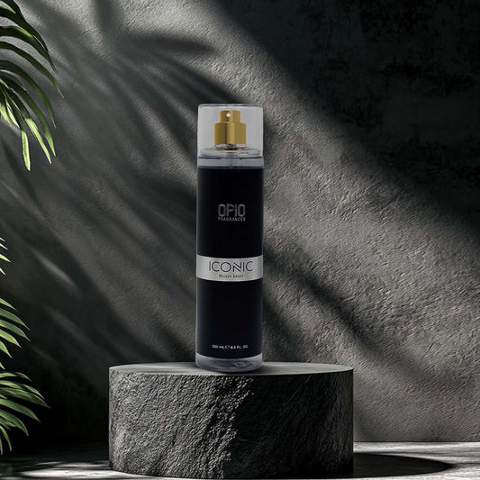 Black spray bottle labeled 'Iconic' on a stone platform with a dark background