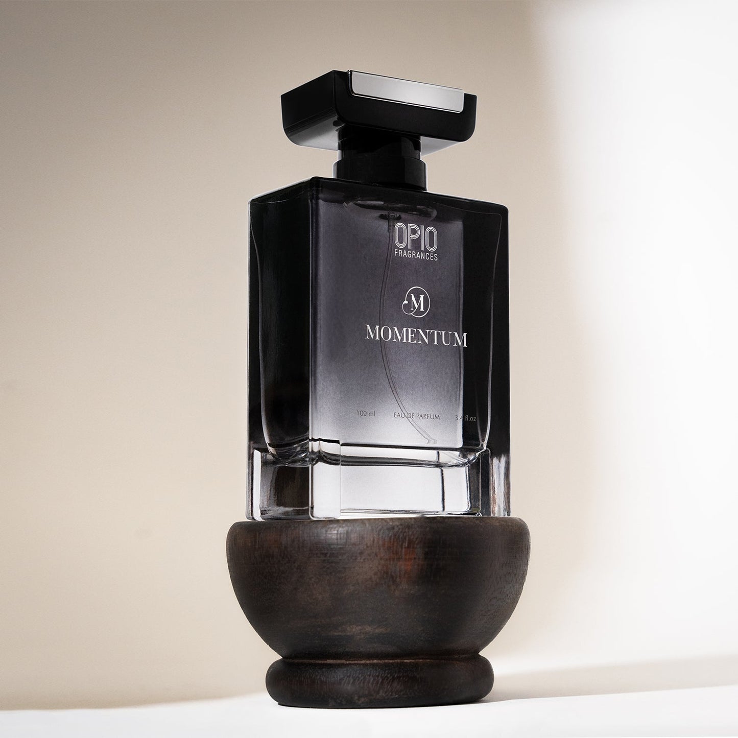 A black bottle of OPIO Momentum eau de parfum for men.