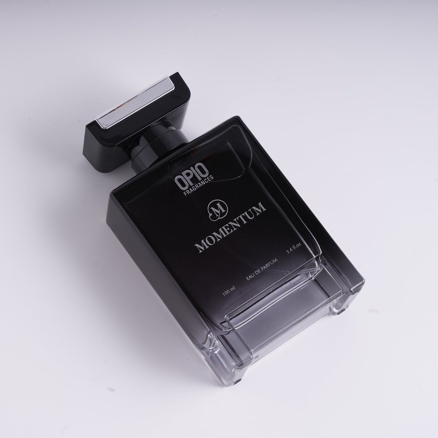 A black bottle of OPIO Momentum eau de parfum for men.