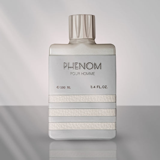 A bottle of Phenom EDP perfume for men, with a clear, elegant design, predominantly white with text and branding in a lighter shade.