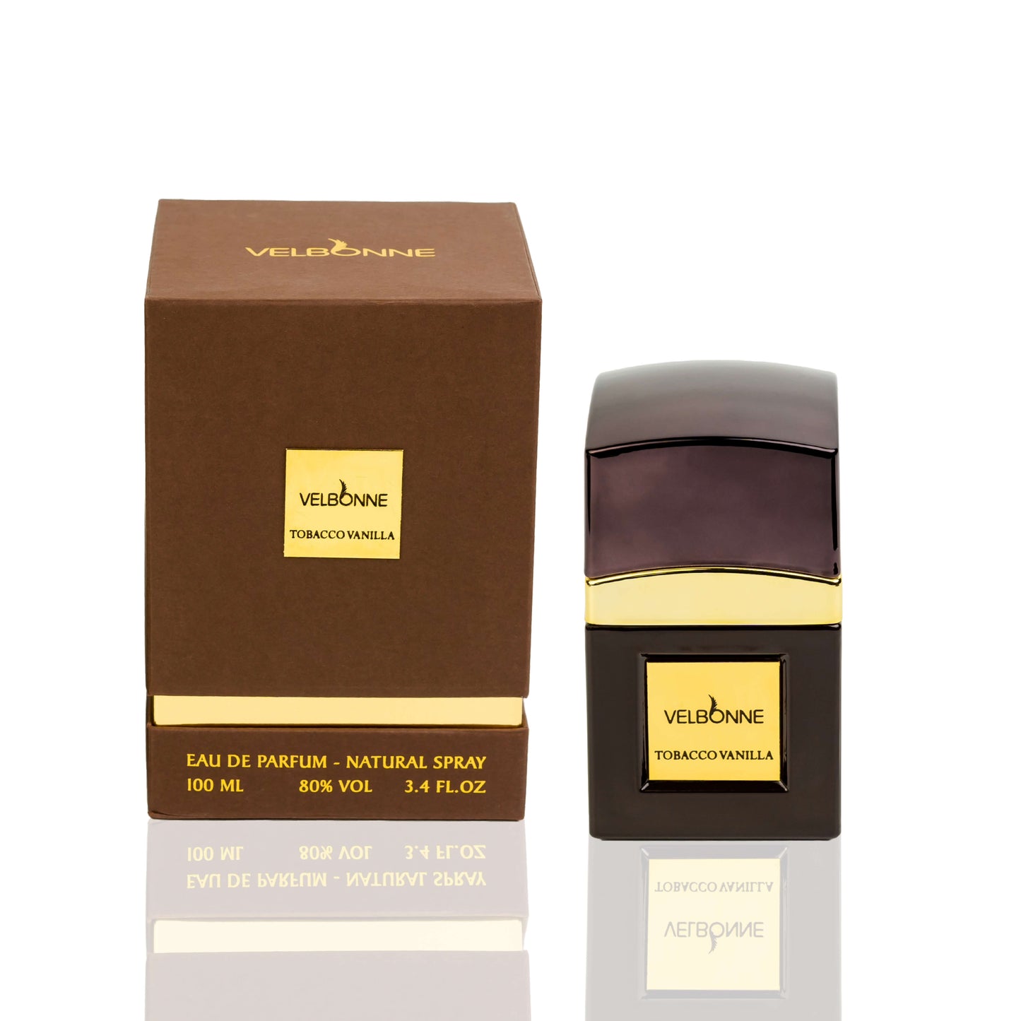 A bottle of TOBACCO & VANILLA EDP perfume next to its packaging box. The bottle is black with a gold label, and the box is brown with 'Tobacco Vanille' written on it.