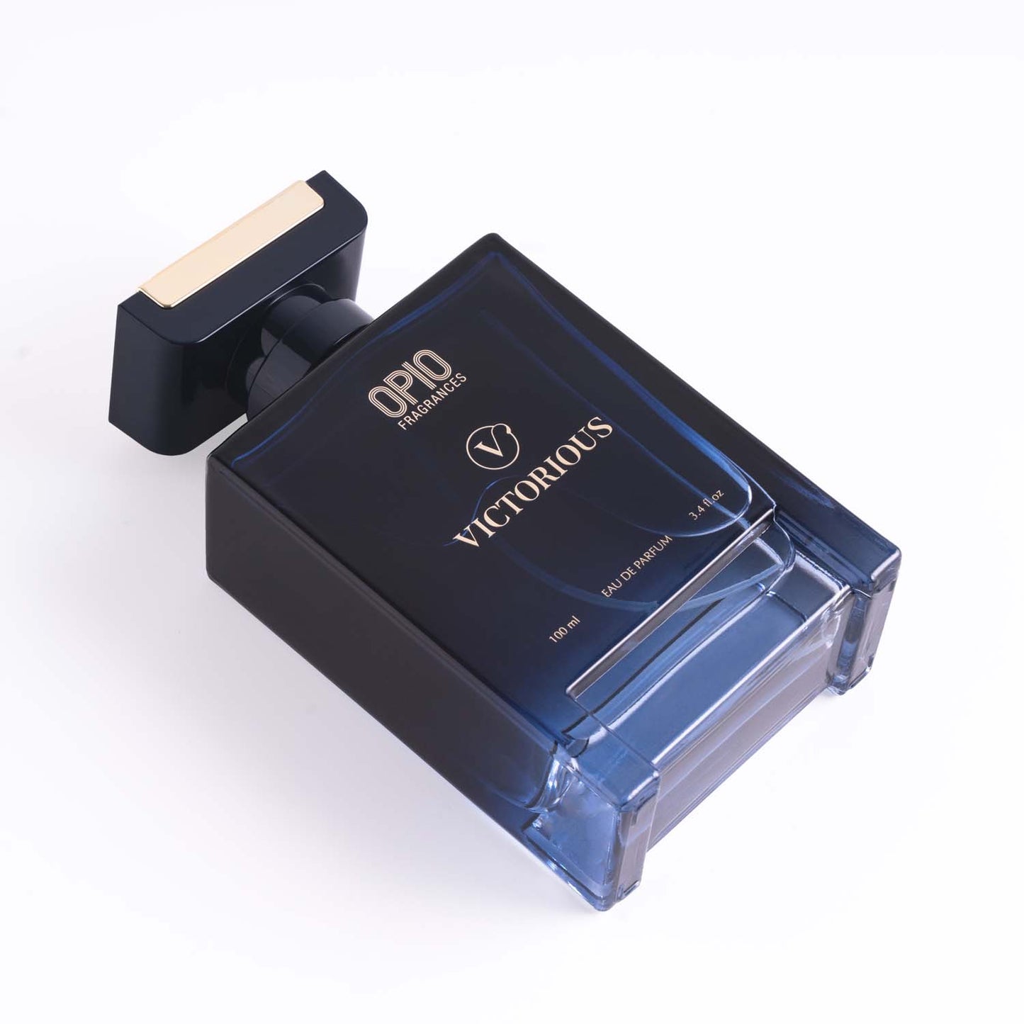 A clear glass bottle of OPIO Victorious fragrance for men.