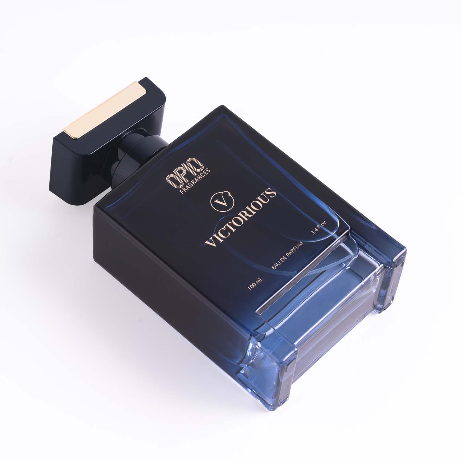A clear glass bottle of OPIO Victorious fragrance for men.